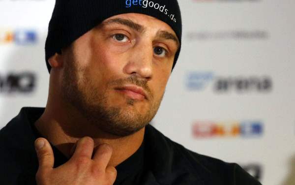 Italian-born heavyweight boxer Pianeta listens to reporters in news conference in Mannheim
