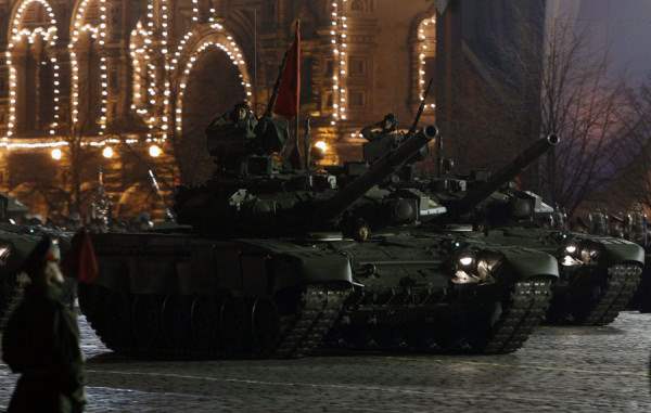 Russian servicemen operate T-90 tanks during a rehearsal for the Victory Day military parade in Red Square in Moscow