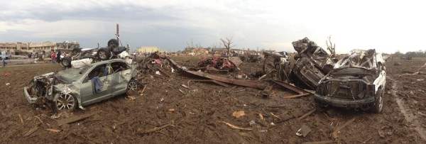 Overturned cars are seen from destruction from a huge tornado near Oklahoma City