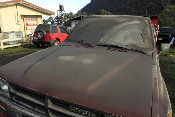 A pickup is covered in ash after an eruption of Turrialba volcano at San Gerardo de Irazu